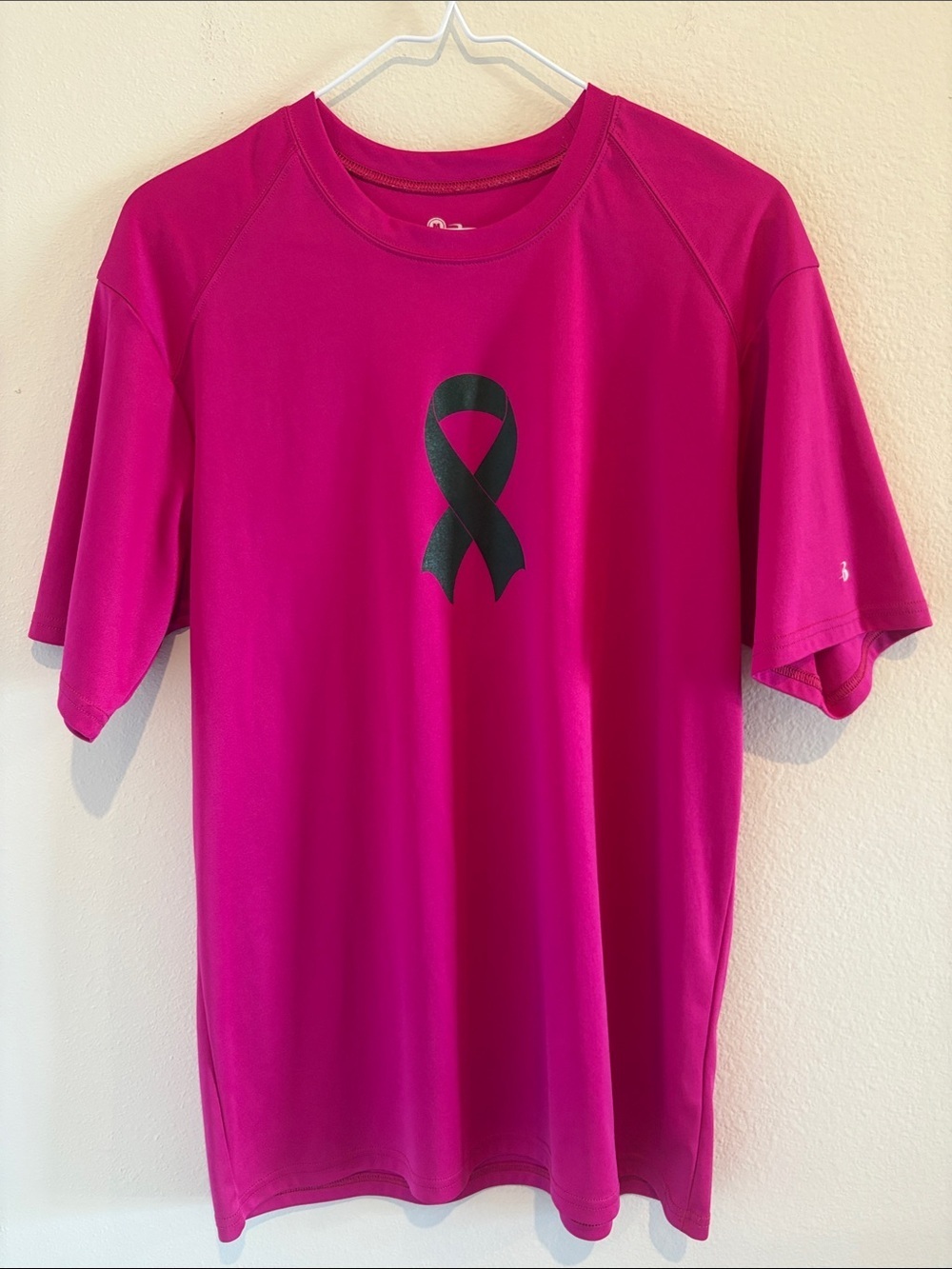 Pink dri fit short sleeve tee shirt  with Ribbon for breast cancer awareness